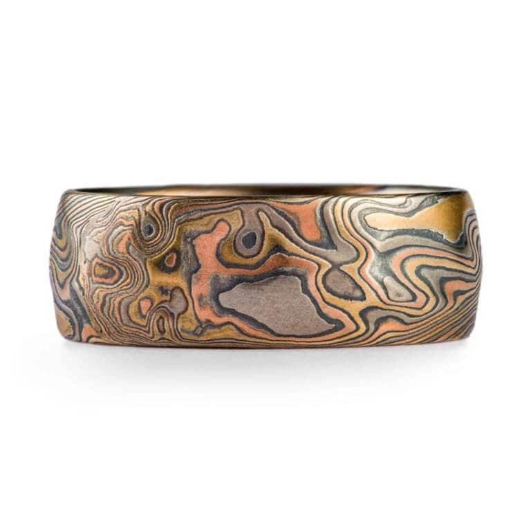 mokume gane large band with multiple golds and metals in twist pattern