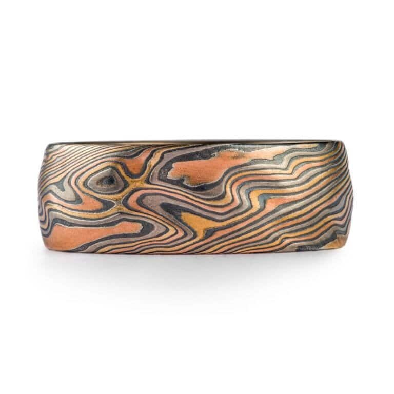 mokume gane large band with multiple golds and metals in twist pattern