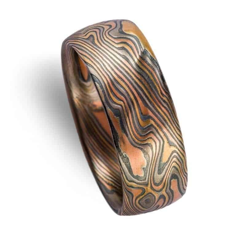 mokume gane large band with multiple golds and metals in twist pattern