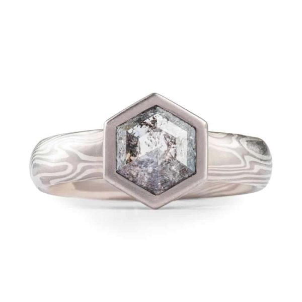 salt and pepper diamond in hexagon cut with hexagon bezel in white gold mokume gane.