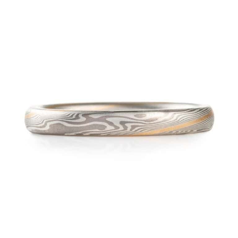 narrow and small, delicate feeling mokume twisted pattern band, made in silvery metals