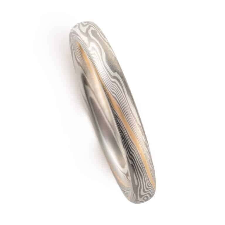 narrow and small, delicate feeling mokume twisted pattern band, made in silvery metals