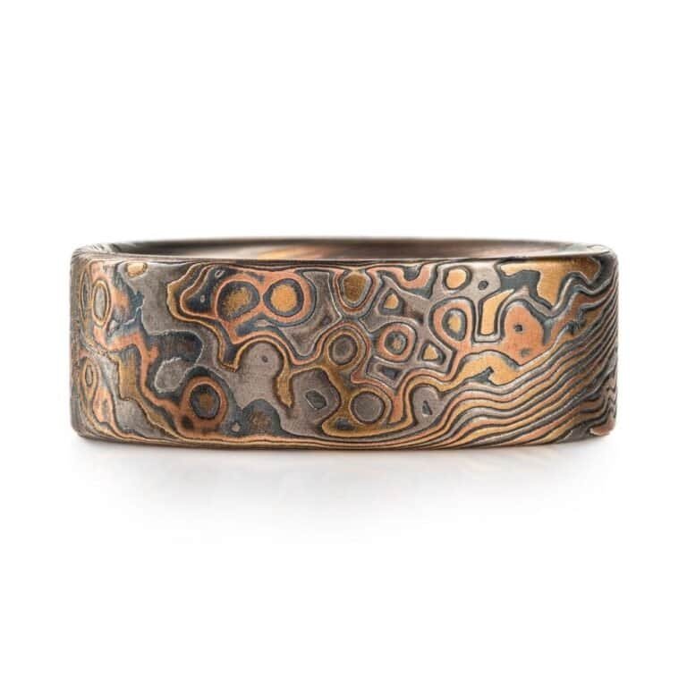 detailed patterned mokume gane band, relatively wide ring, flat profiled, with textured etched finish