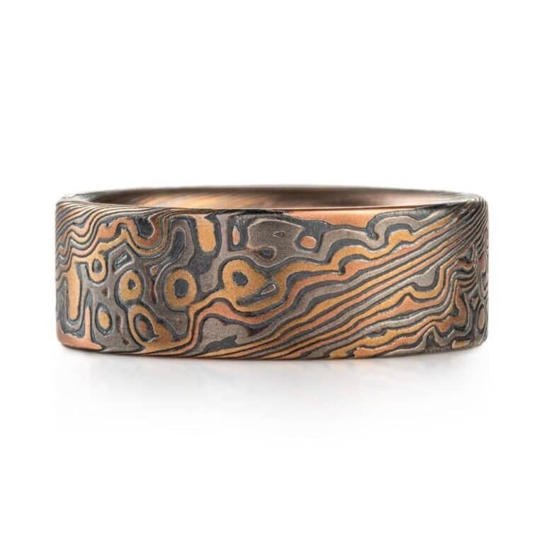 detailed patterned mokume gane band, relatively wide ring, flat profiled, with textured etched finish