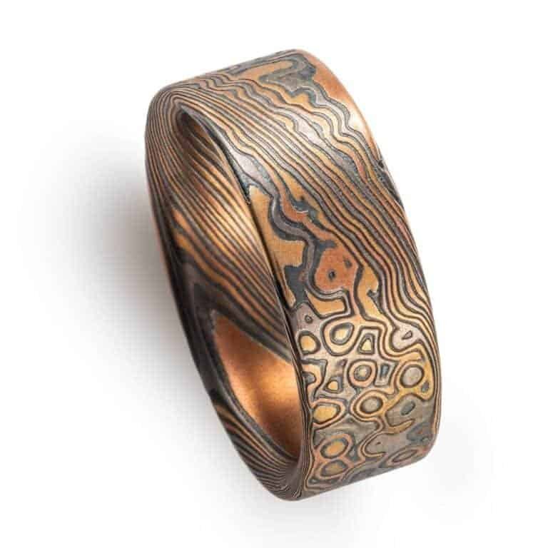 detailed patterned mokume gane band, relatively wide ring, flat profiled, with textured etched finish