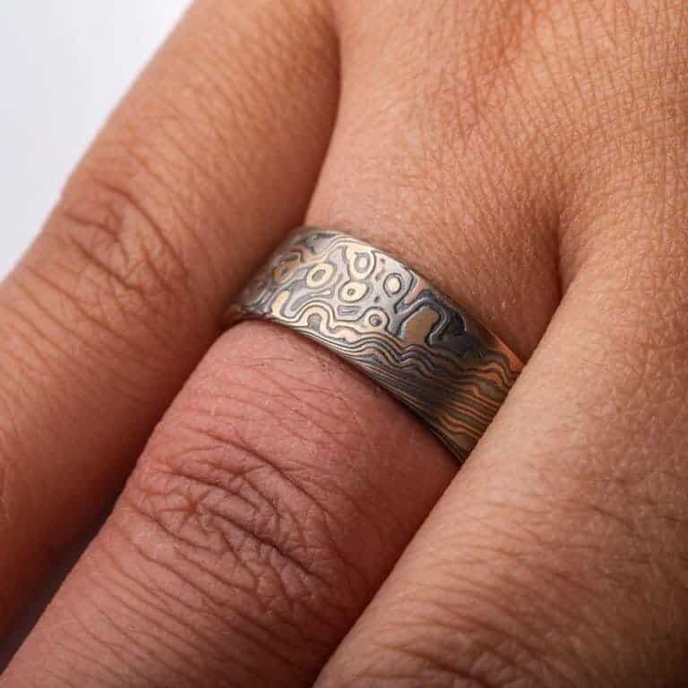 detailed patterned mokume gane band, relatively wide ring, flat profiled, with textured etched finish