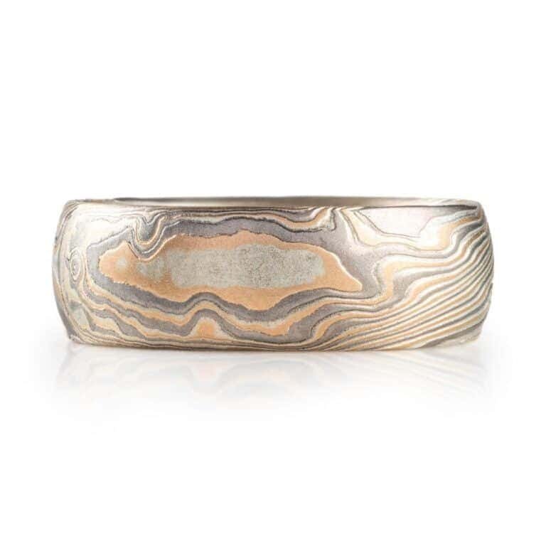 wide twisted pattern ring with textured finish, made with yellow gold, palladium and silver