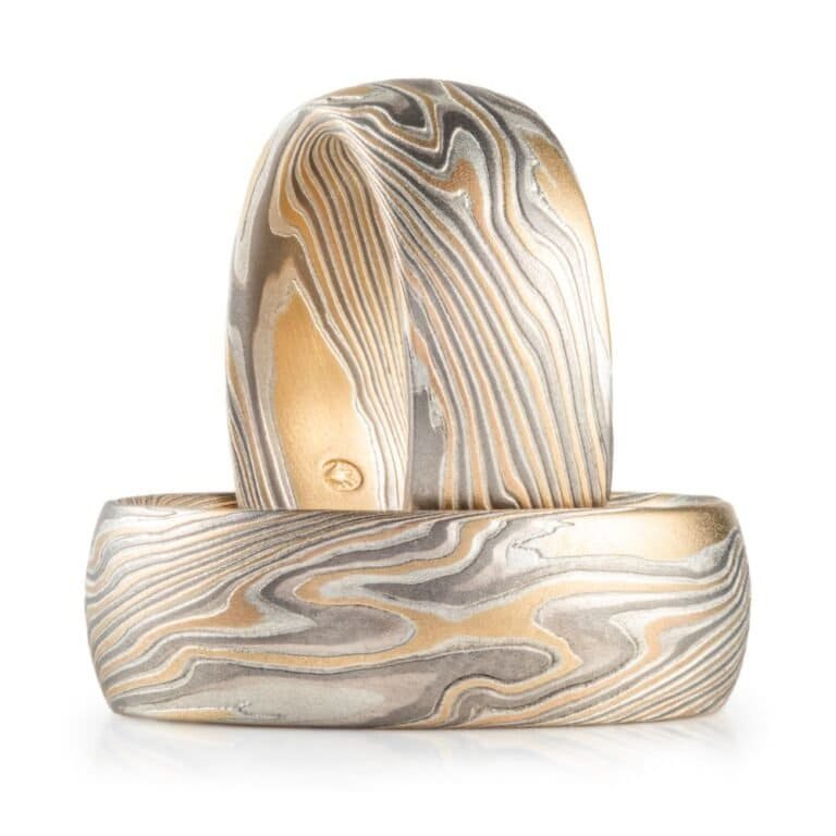 set of matching mokume gane rings in similar widths and a twisted pattern