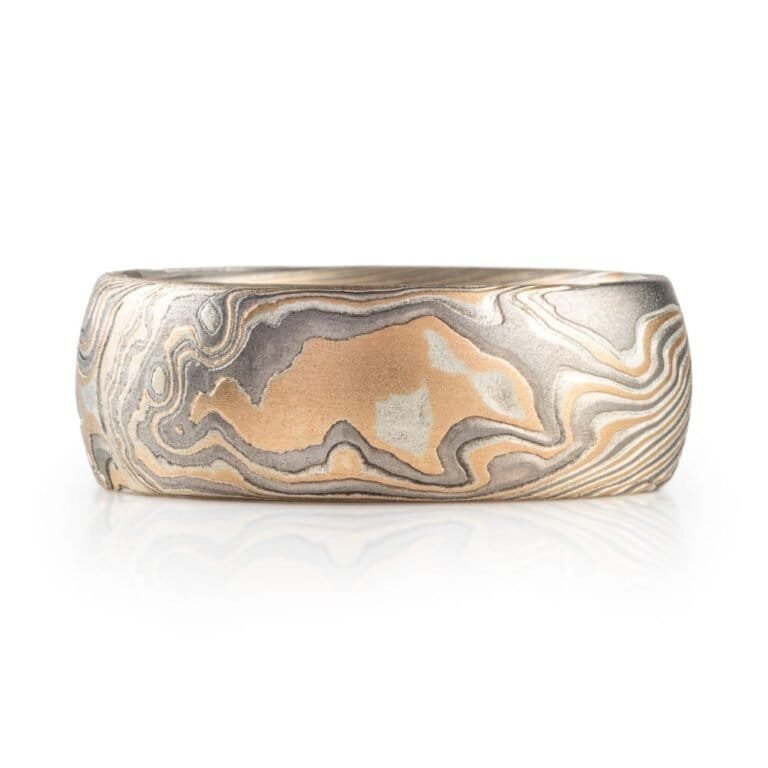 wide twisted pattern ring with textured finish, made with yellow gold, palladium and silver