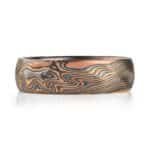 mokume twist pattern ring, made with red and yellow gold, palladium and oxidized silver, with some added texture