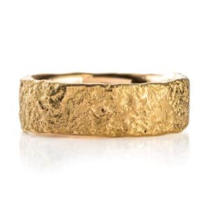 A 20kt yellow gold ring with stone texture and a flat profile, shown in 7.5mm width and size 11.