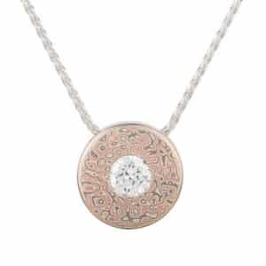 Unique Mokume Gane pendant with 16mm diameter, Droplet pattern, Embers palette, round-cut diamond, inspired by vintage designs.