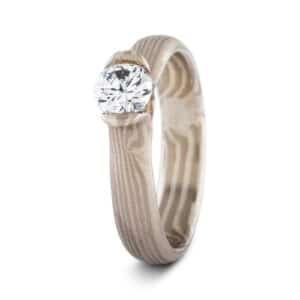Discontinued Wave pattern 4mm Mokume Gane ring in Ash metal with bloom-set topaz, low dome profile and satin finish.