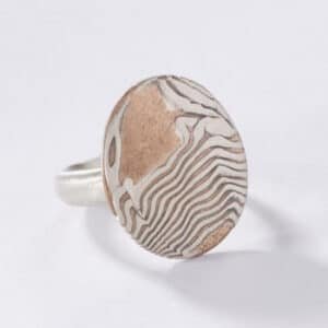A unique silver and copper mokume signet ring with a classical look.