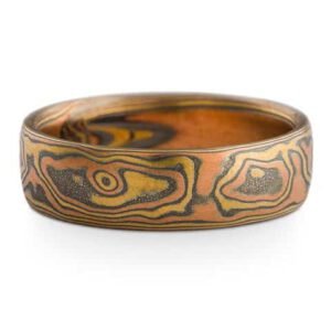 Ring made in mokume gane pattern, with red gold, yellow gold and oxidized silver.