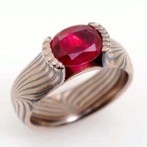 mokume_gane_ring_wedding_ring_with_bloom_set_ruby_wave_pattern_oxidized_flame_palette1