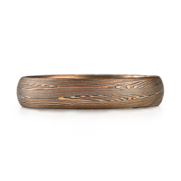 mokume gane narrow band in red gold yellow gold palladium and oxidized silver palette, very linear and detailed pattern