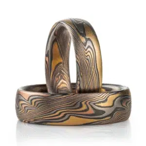 Mokume gane twist pattern ring set, Firestorm palette - red gold, yellow gold, palladium and oxidized silver