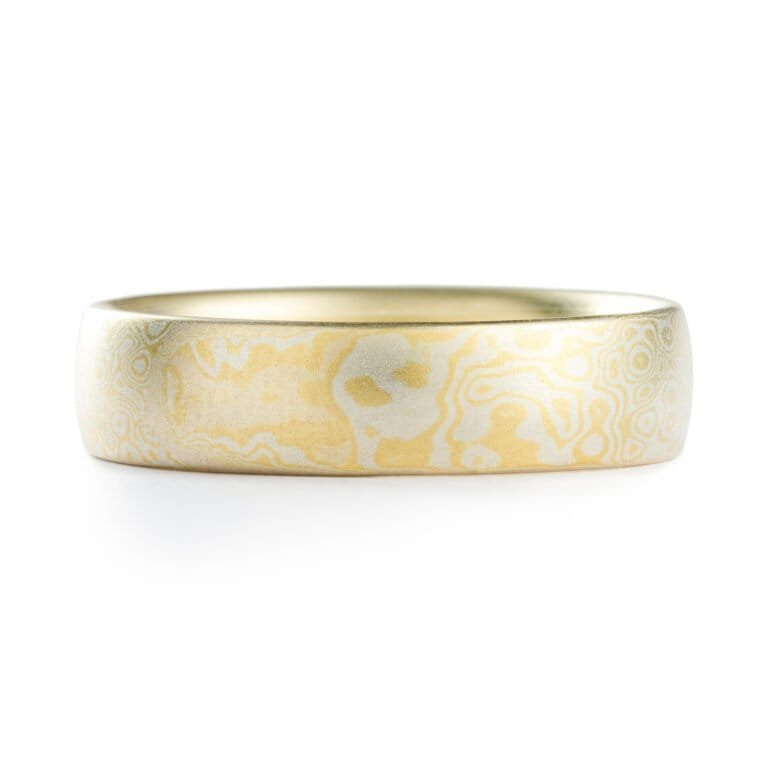 Gold and silver mokume gane patterned ring by arn krebs, pattern resembles droplets hitting the surface of water