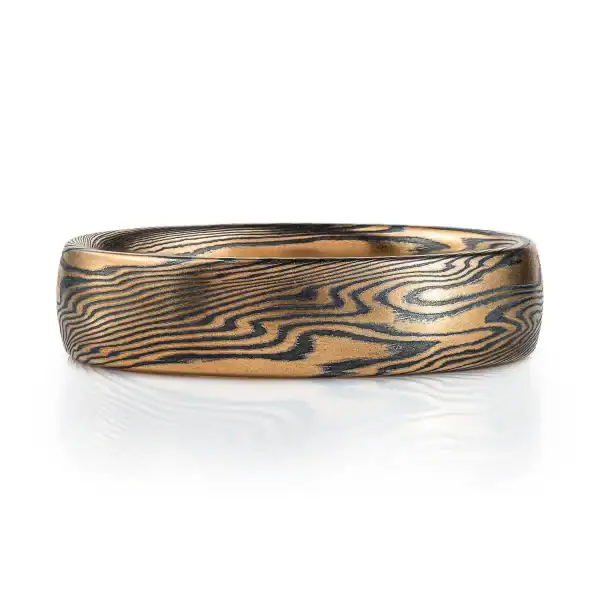 Mokume gane ring mens wedding band High contrast mokume gane mens wedding band ring. Unisex. Gold and blackened oxidized black sterling silver unique nature inspired woodgrain patterned two toned tone yellow white gold alternative metal