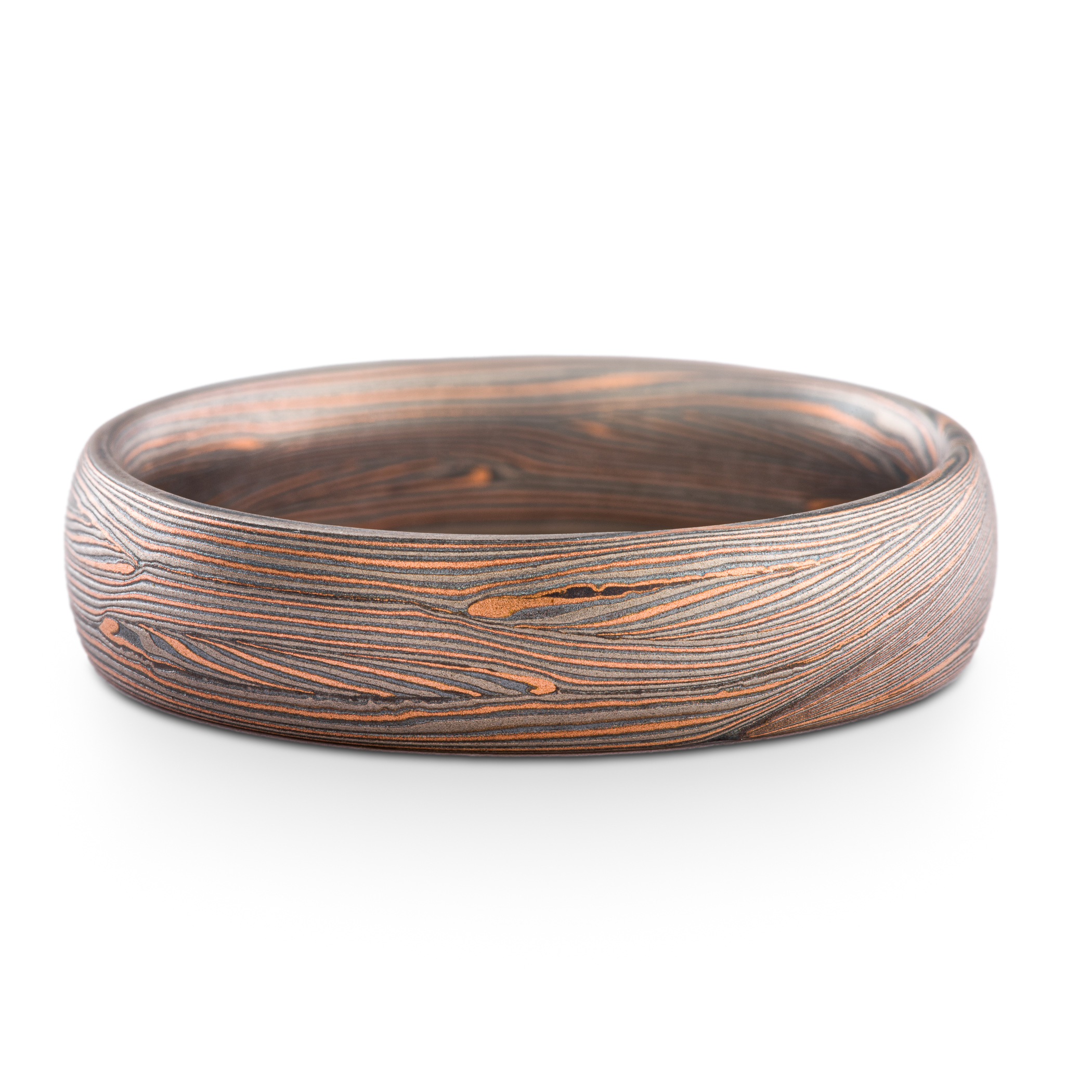 Mokume gane ring made in Arn Krebs Flow pattern made in a linear style with flowing fine lines. Made with red gold, palladium and oxidized silver.