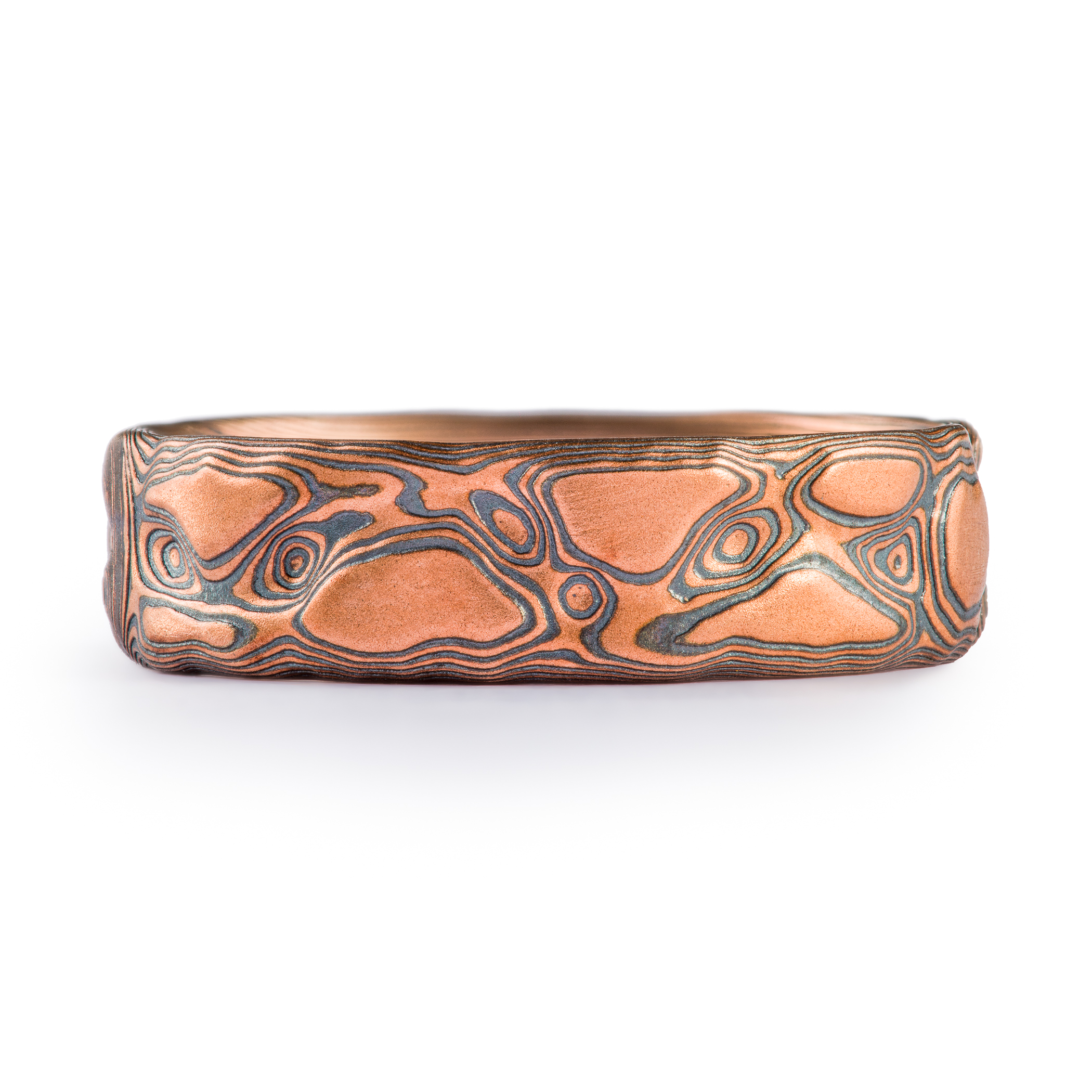 Red gold and oxidized silver textured band made to look like rock.