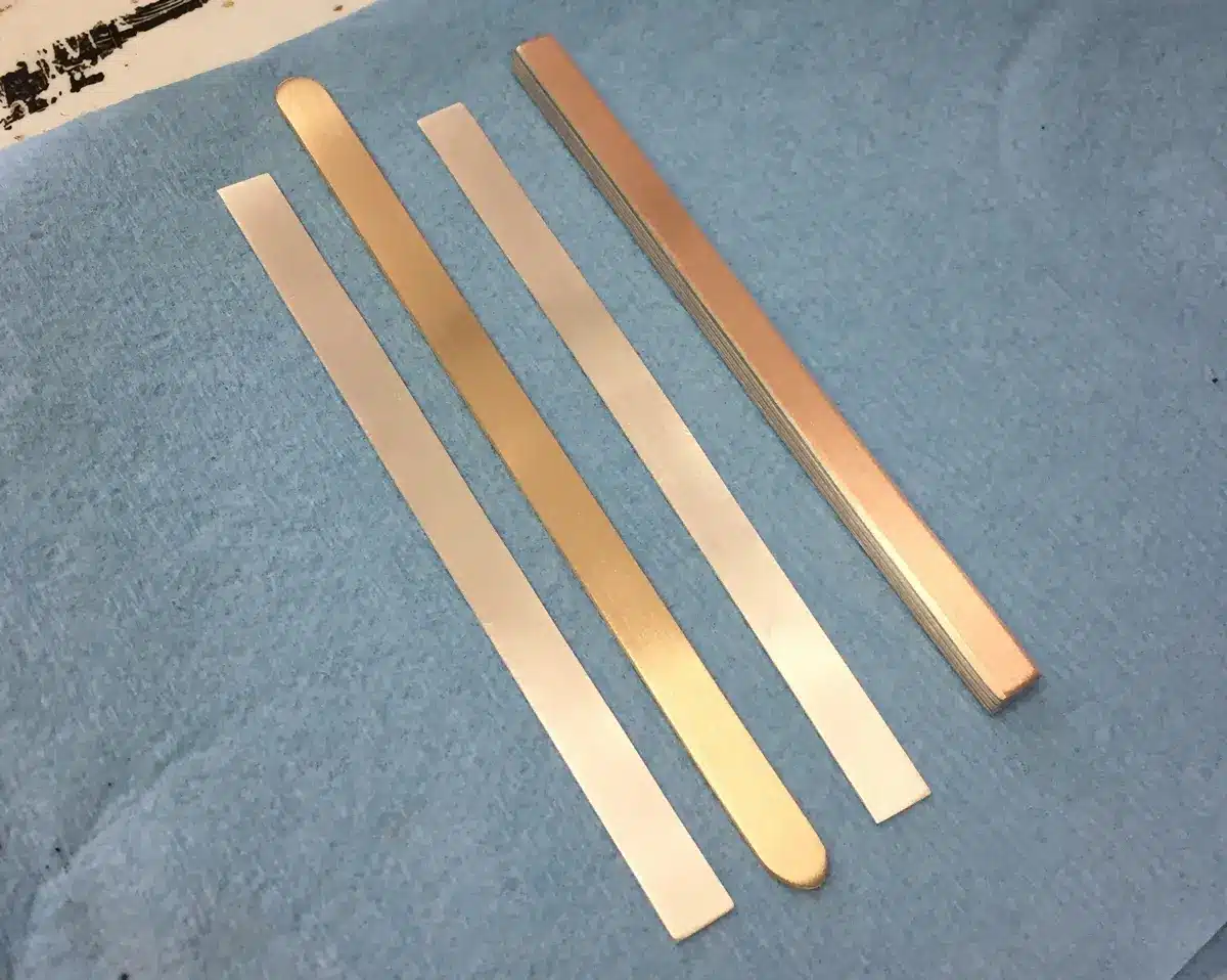 pieces of metal laid out for a mokume gane billet