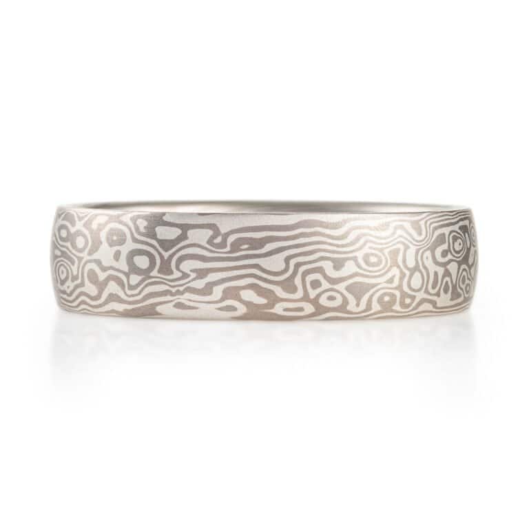 smooth finished, domed, mokume gane ring made with silver and palladium in a twist and droplet combination pattern