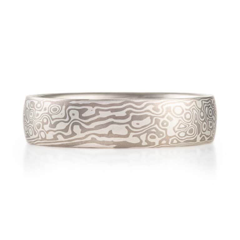 smooth finished, domed, mokume gane ring made with silver and palladium in a twist and droplet combination pattern