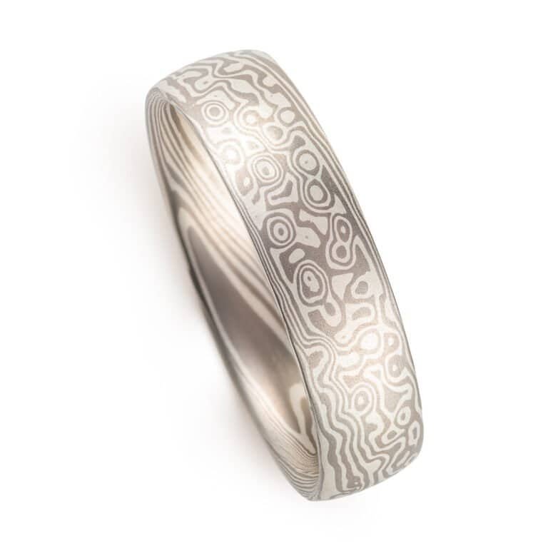 smooth finished, domed, mokume gane ring made with silver and palladium in a twist and droplet combination pattern