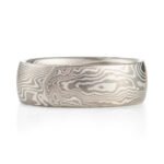 ash palette ring made with layers of palladium and silver, made in a twisted mokume gane pattern