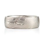 ash palette ring made with layers of palladium and silver, made in a twisted mokume gane pattern