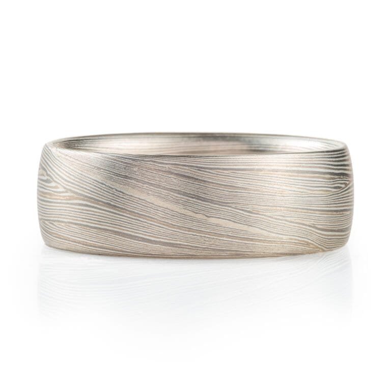 layered metal that looks like fabric or waves, undulating, lines. contemporary modern elegant sleek ring