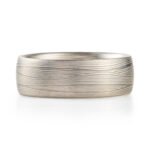 layered metal that looks like fabric or waves, undulating, lines. contemporary modern elegant sleek ring