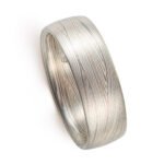 layered metal that looks like fabric or waves, undulating, lines. contemporary modern elegant sleek ring