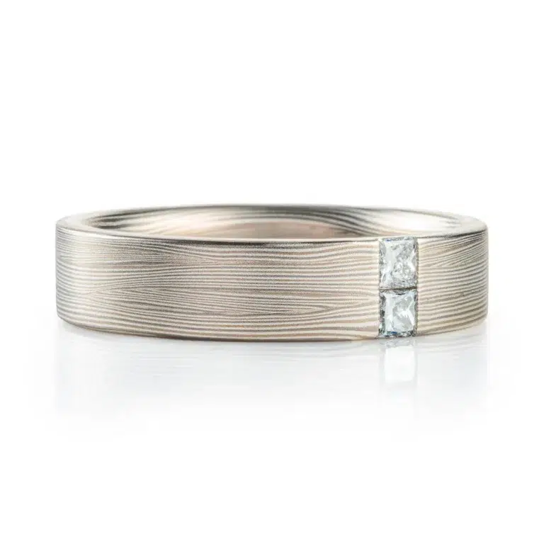 modern contemporary silver and palladium white metal with a square diamonds set in the flowing lines of metal