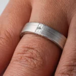 modern contemporary silver and palladium white metal with a square diamonds set in the flowing lines of metal