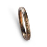 mokume gane woodgrain patterned, metals in the ring are red gold silver and palladium