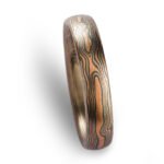 mokume gane woodgrain patterned, metals in the ring are red gold silver and palladium