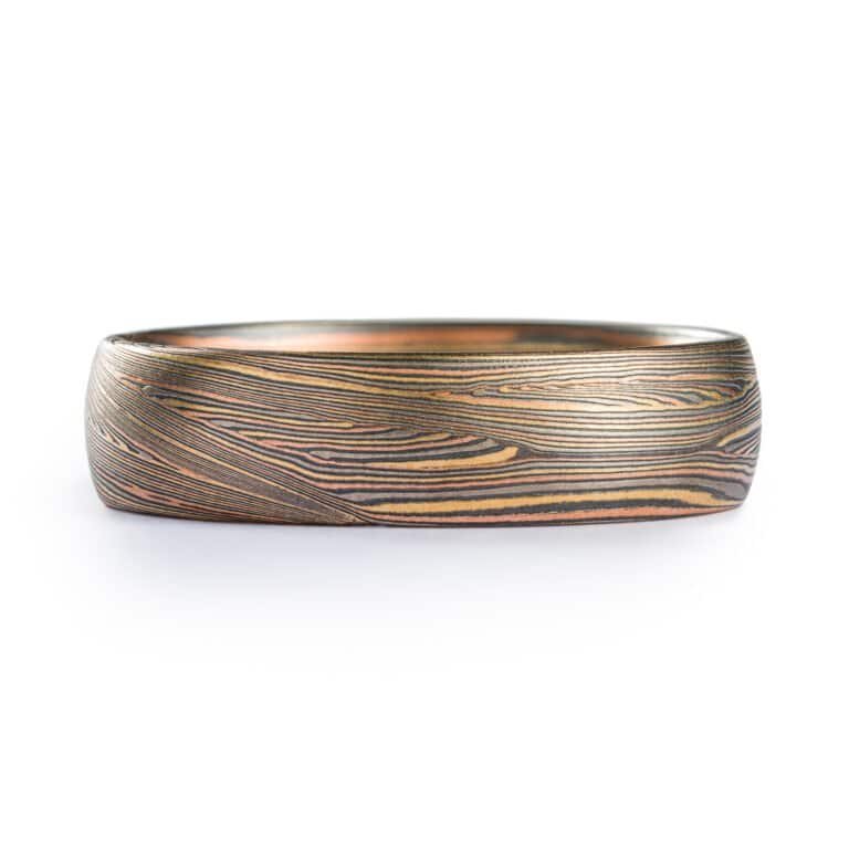 fine lines in this contemporary ring with Tri golds and silver. flowing lines. Todd reed quality. high end. fine jewelry and fine art ring with signature pattern