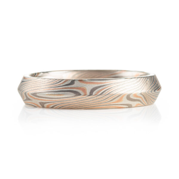 modern feeling beveled edge mokume gane ring in twist/star pattern with red gold palladium and silver