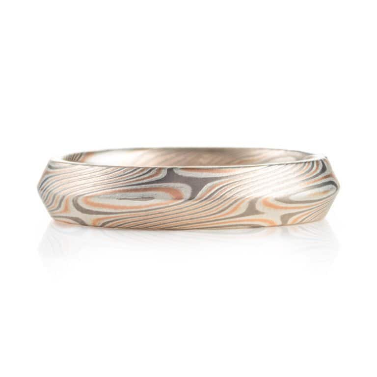 modern feeling beveled edge mokume gane ring in twist/star pattern with red gold palladium and silver