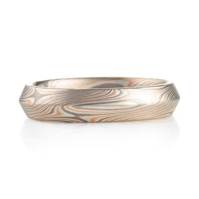 modern feeling beveled edge mokume gane ring in twist/star pattern with red gold palladium and silver