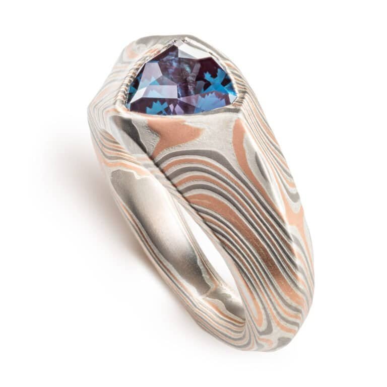 custom made mokume gane ring, wide tapered ring with a beveled edge and large triangular blue stone