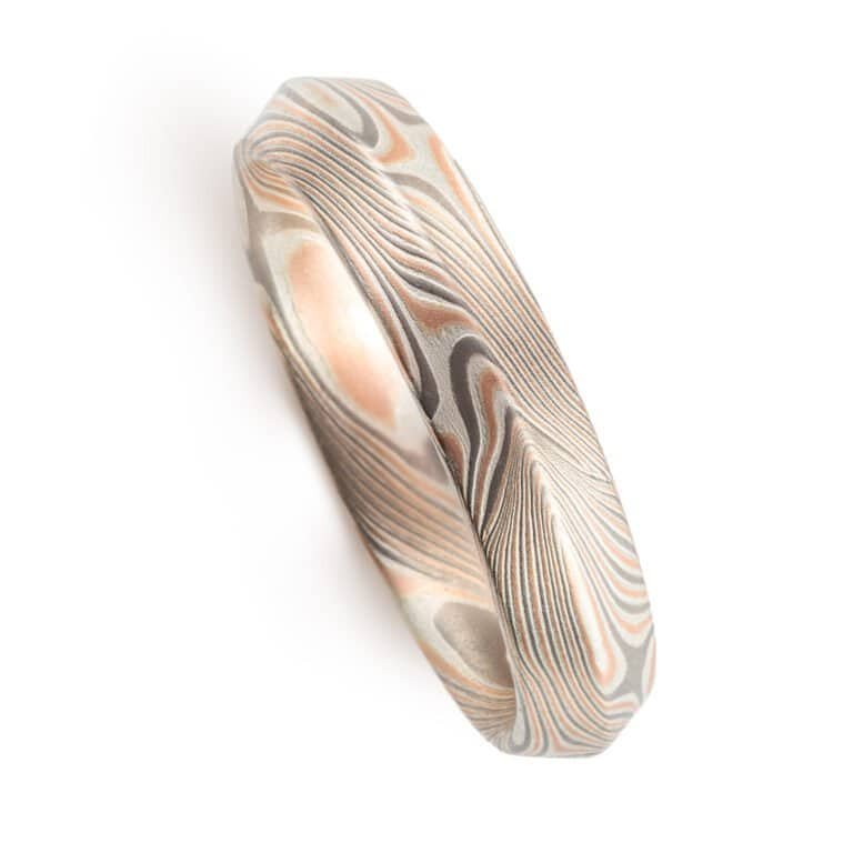 modern feeling beveled edge mokume gane ring in twist/star pattern with red gold palladium and silver