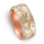mokume gane ring, carved to create topographic texture, metals used are yellow gold red gold palladium and sterling silver