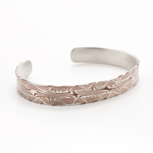 Mokume gane cuff made in unique welded pattern of copper and silver.
