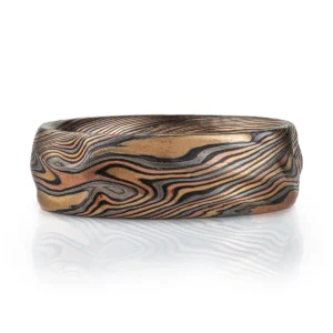 Ring or wedding band in combination of red gold, yellow gold, palladium and silver with an etched and oxidized finish.