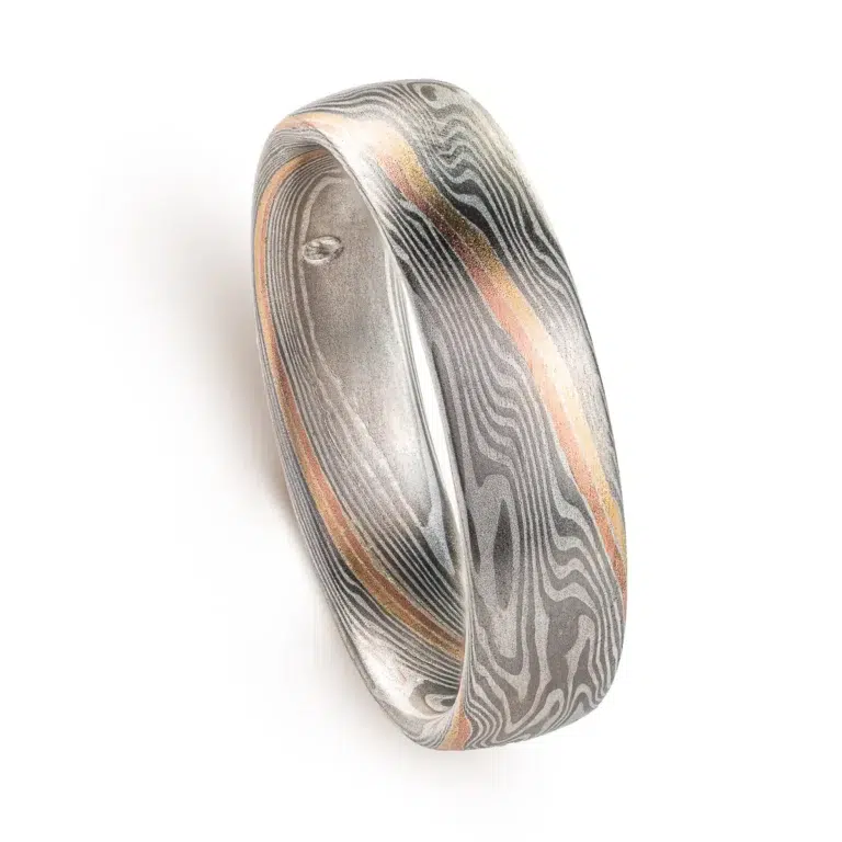 specialty mokume gane band with double stratum accent