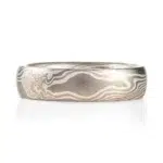 mokume gane low dome band in twisted pattern using white gold, silver and palladium